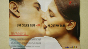 An HIV awareness campaign in a counseling room at the San Francisco de Assisi Hospital in Rio de Janeiro, Brazil. The poster says, "One of them has HIV. The other one knows."