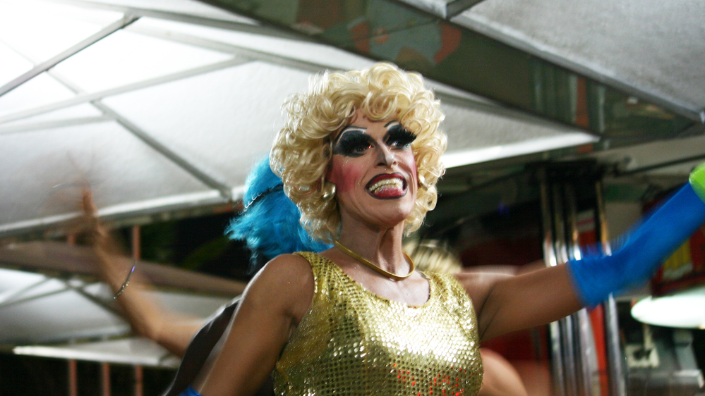 Drag queens at an outdoor restaurant in Copacabana incorporate safe sex messages into a show of lip-synced songs and risque jokes.