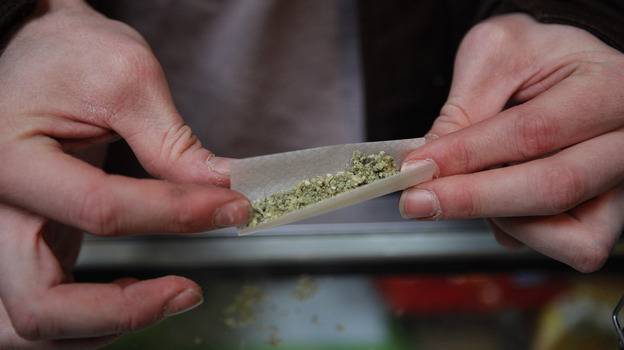 A marijuana cigarette in British Columbia. Our panel of economists agrees that criminalizing pot is a huge waste of resources.