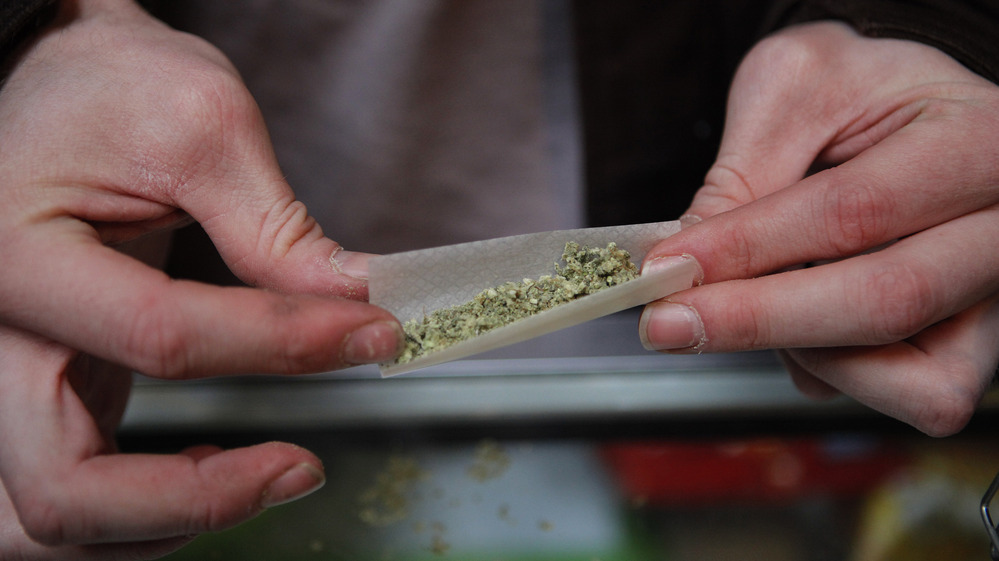 A marijuana cigarette in British Columbia. Our panel of economists agrees that criminalizing pot is a huge waste of resources.