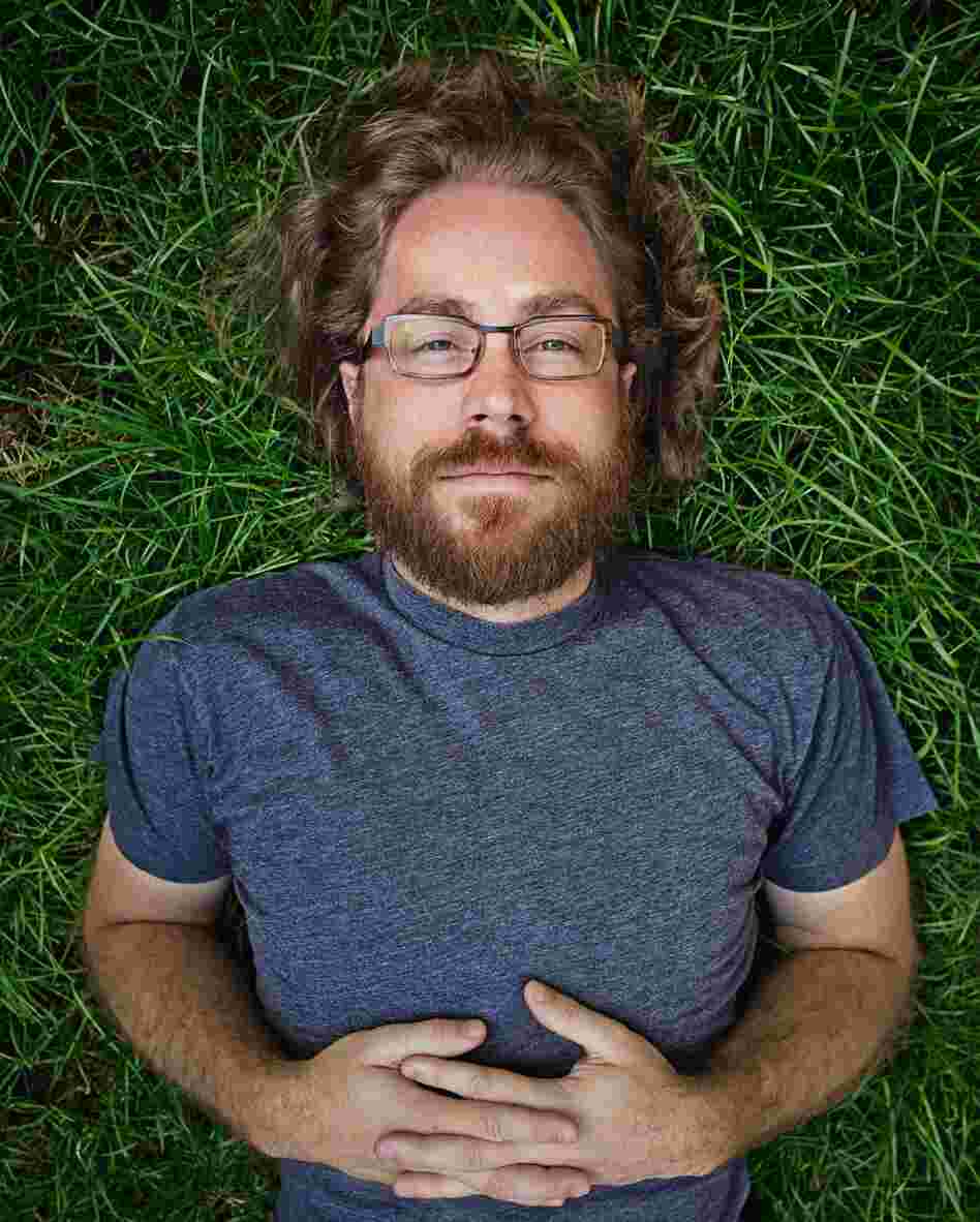 Ask Me Another resident musician, Jonathan Coulton, keeps audiences entertained with his offbeat lyrics and entertaining covers of popular music. JoCo quit his day job writing software in 2005 to pursue a career in music.
