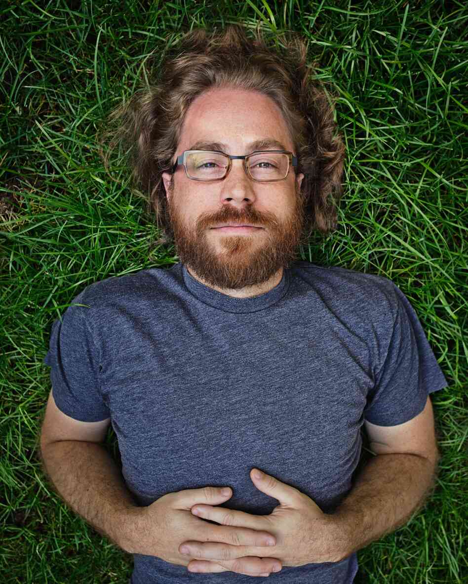 Ask Me Another resident musician, Jonathan Coulton, keeps audiences entertained with his offbeat lyrics and entertaining covers of popular music. JoCo quit his day job writing software in 2005 to pursue a career in music.