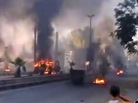 An image grab taken from a video uploaded on YouTube on Wednesday shows smoke billowing from burning tires and trash containers in Damascus. An image grab taken from a video uploaded on YouTube on Wednesday shows smoke billowing from burning tires and trash containers in Damascus.