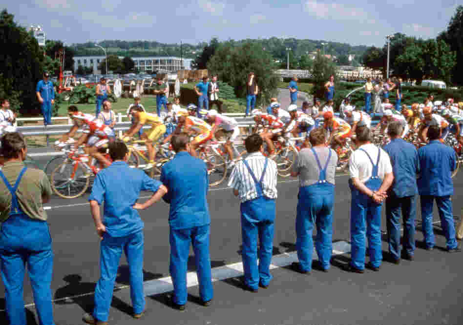 "I was out on the course and there was nothing. Then all of a sudden the road came up on a factory, and there was a sea of workers in blue uniforms. It was perfect — the pattern of the blue bibs," says Startt about this photo from the 1997 Tour.
