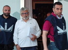 Giuseppe Mandara (in white shirt, with cigar), and officers from the Anti-Mafia unit of the Italian police on Tuesday. Giuseppe Mandara (in white shirt, with cigar), and officers from the Anti-Mafia unit of the Italian police on Tuesday.