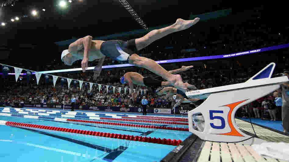 Researchers studying brains want to know what's happening in an area called the premotor cortex — the place in the brain that gears up for something the body is about to do, like swimming. Above, Michael Phelps dives off the starting blocks in the final heat of the men's 400-meter individual medley during the 2012 U.S. Olympic Swimming Team Trials in Omaha, Neb., on June 25. Researchers studying brains want to know what's happening in an area called the premotor cortex — the place in the brain that gears up for something the body is about to do, like swimming. Above, Michael Phelps dives off the starting blocks in the final heat of the men's 400-meter individual medley during the 2012 U.S. Olympic Swimming Team Trials in Omaha, Neb., on June 25.