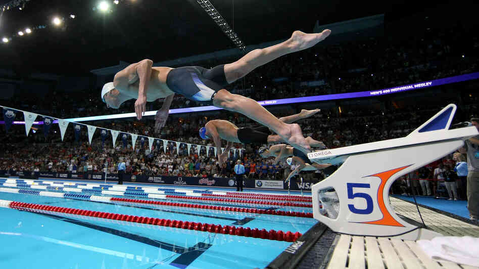 Researchers studying brains want to know what's happening in an area called the premotor cortex — the place in the brain that gears up for something the body is about to do, like swimming. Above, Michael Phelps dives off the starting blocks in the final heat of the men's 400-meter individual medley during the 2012 U.S. Olympic Swimming Team Trials in Omaha, Neb., on June 25. Researchers studying brains want to know what's happening in an area called the premotor cortex — the place in the brain that gears up for something the body is about to do, like swimming. Above, Michael Phelps dives off the starting blocks in the final heat of the men's 400-meter individual medley during the 2012 U.S. Olympic Swimming Team Trials in Omaha, Neb., on June 25.