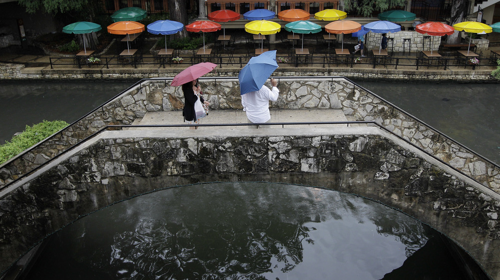 Pedestrians stand along the River Walk in San Antonio, Texas, in May. The state has gotten a reprieve from more than a year of drought.