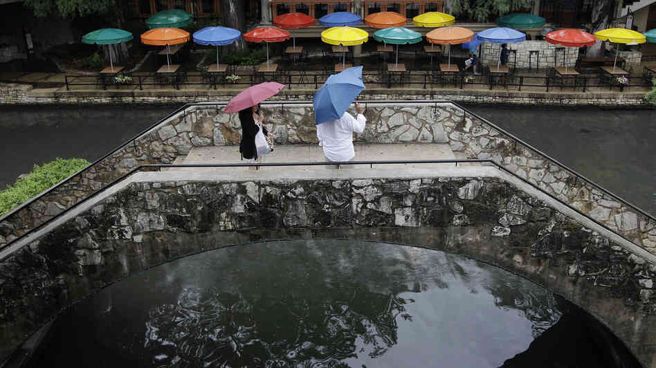 Pedestrians stand along the River Walk in San Antonio, Texas, in May. The state has gotten a reprieve from more than a year of drought.