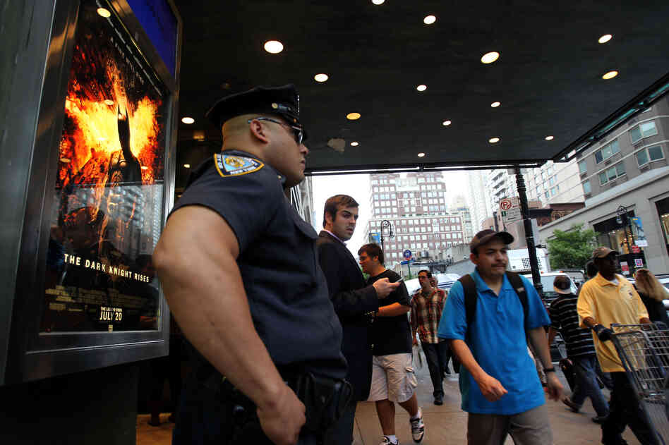 A policeman stands outside a movie theater in New York on Friday during a showing of "The Dark Knight Rises." A policeman stands outside a movie theater in New York on Friday during a showing of "The Dark Knight Rises."