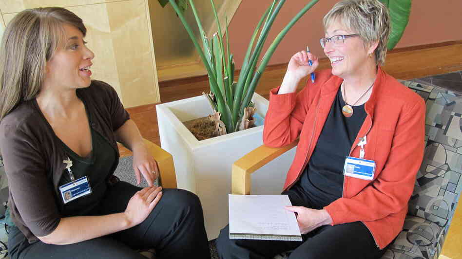 Shannon Orley, left, meets with her health coach, Kelly Heithold, right, at Providence Alaska Medical Center.
