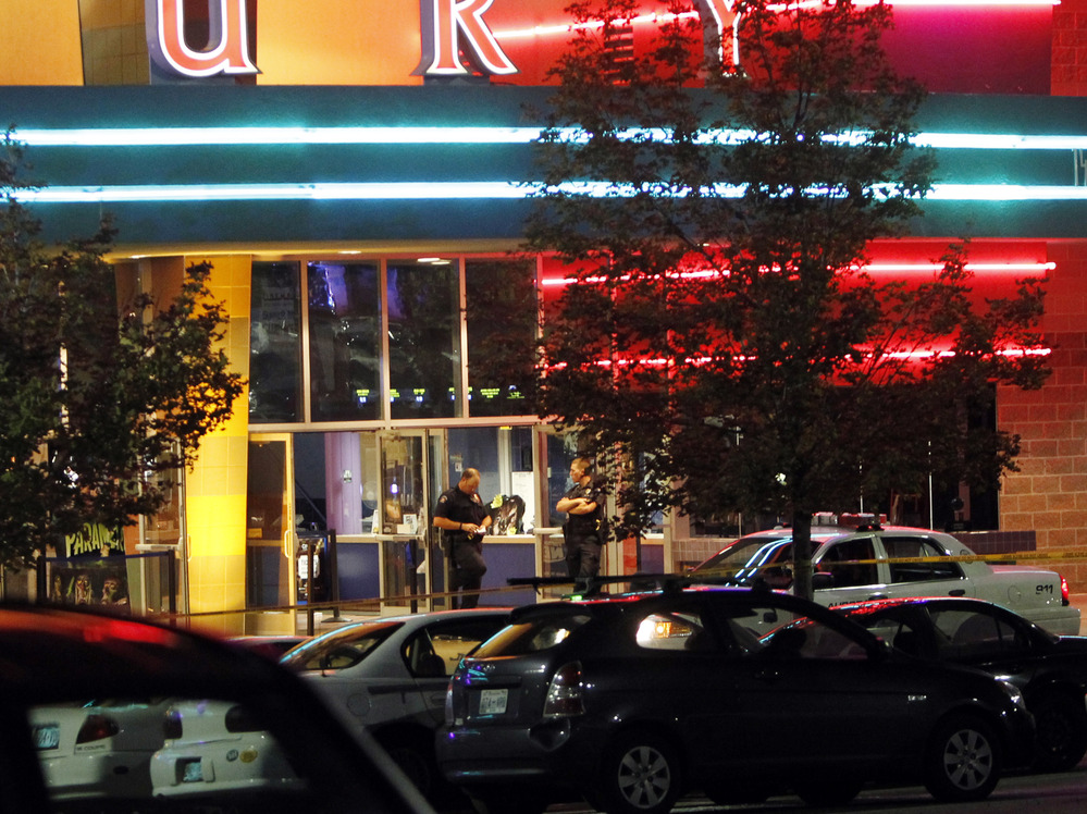 A police officer outside the Century 16 movie theater in Aurora, Colo., early Friday after a gunman opened fire on people watching a midnight screening of The Dark Knight Rises.
