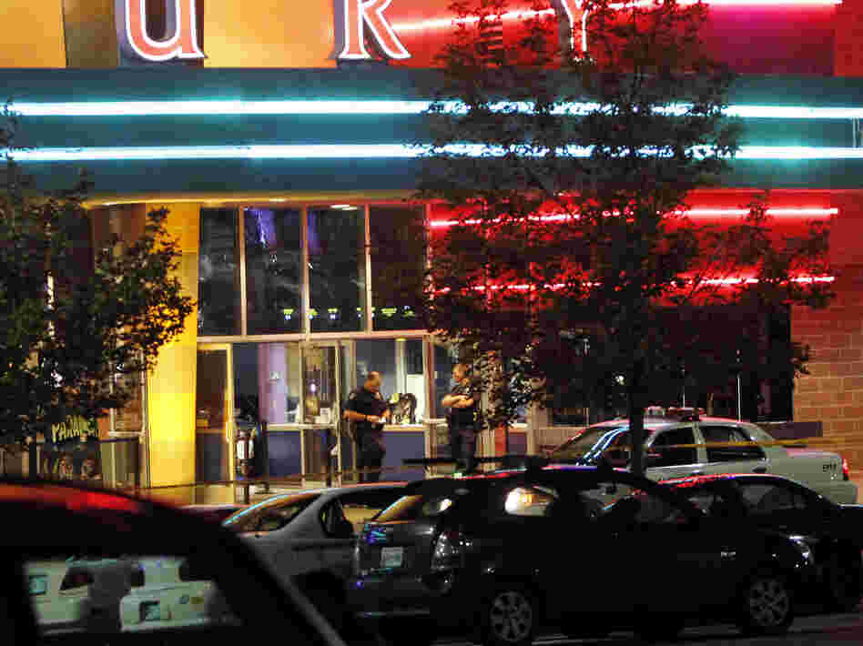 A police officer outside the Century 16 movie theater in Aurora, Colo., early Friday after a gunman opened fire on people watching a midnight screening of The Dark Knight Rises.