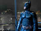 Emotional Armor: Superheroes like Batman (Christian Bale) function as talismans when our fears are darkest — symbols of good, and of justice, when we wonder whether either exists.