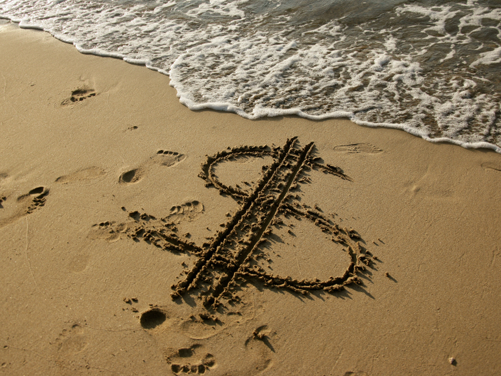 Dollar sign in the sand