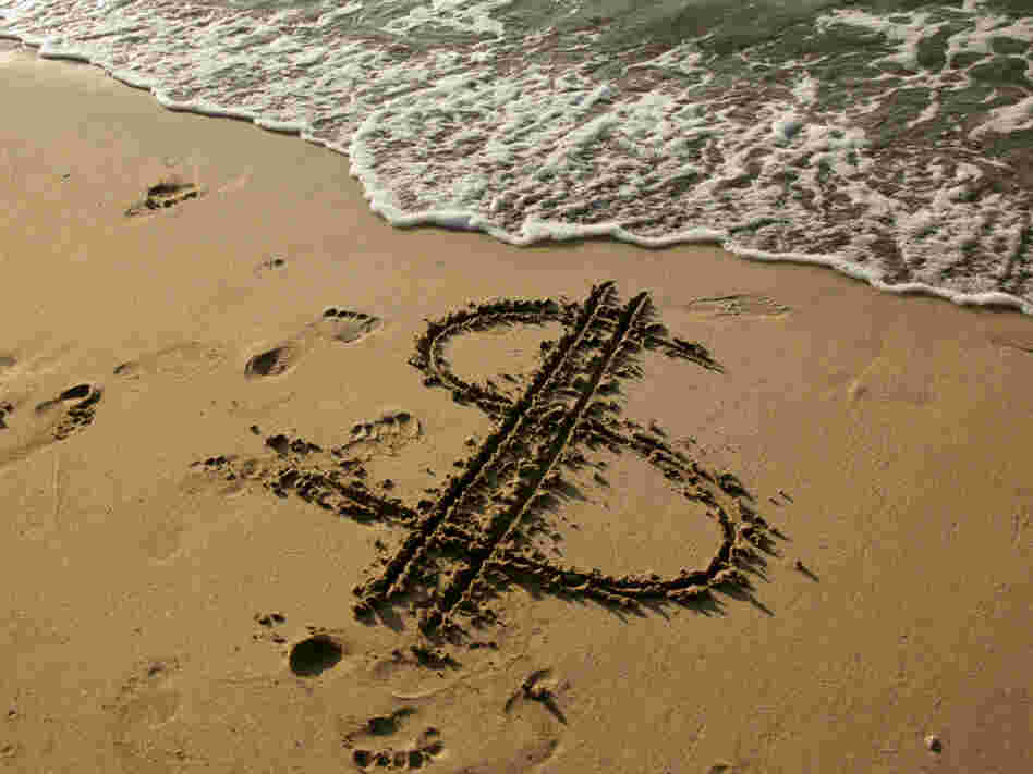 Dollar sign in the sand