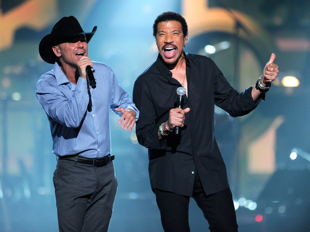 Kenny Chesney (left) performs with Lionel Richie at an April 2 event called Lionel Richie and Friends in Concert in Las Vegas. Other performers at the concert included country stars Tim McGraw, Jason Aldean, The Band Perry and Rascal Flatts.