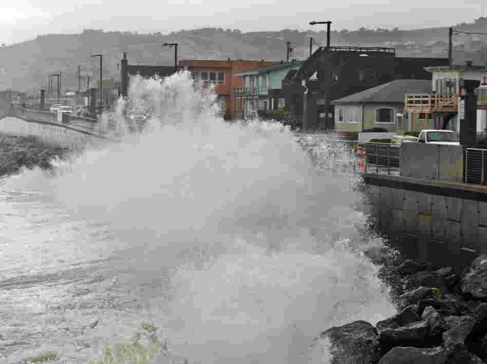 Waves pound a sea wall in Pacifica, Calif., during a storm in 2010. Small assumptions can make a big difference when putting a price-tag on future disasters. Waves pound a sea wall in Pacifica, Calif., during a storm in 2010. Small assumptions can make a big difference when putting a price-tag on future disasters.