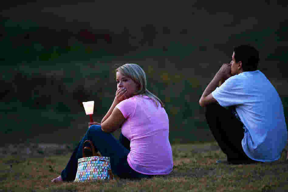Mourners also held a candelight vigil in Devner, Colo., Friday.