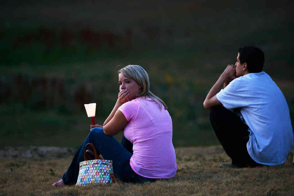 Mourners also held a candelight vigil in Devner, Colo., Friday.