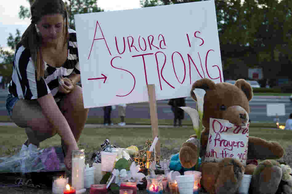 Mourners held a vigil in Aurora Friday, though an official one is scheduled for Sunday evening.
