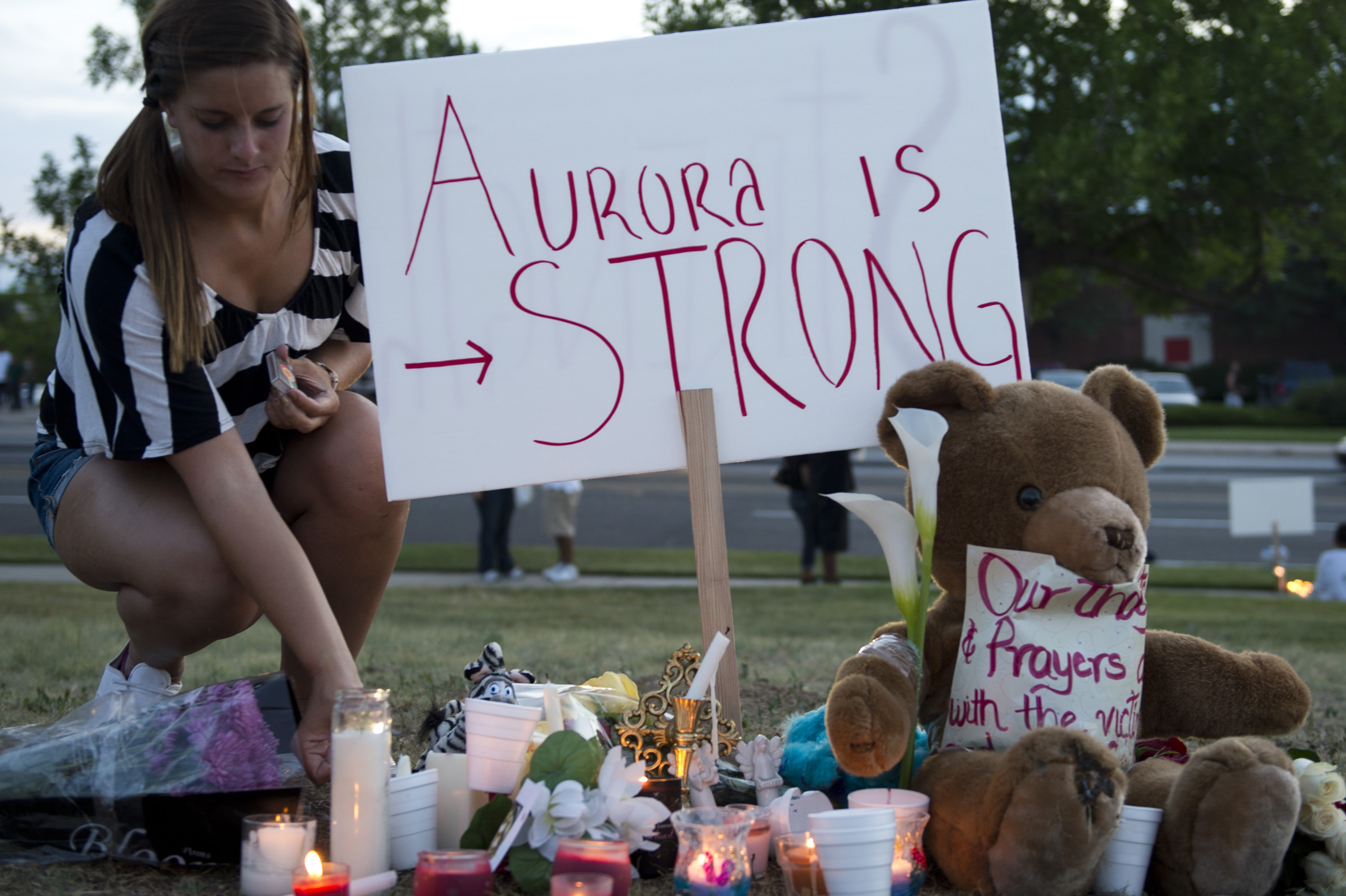 Mourners held a vigil in Aurora Friday, though an official one is scheduled for Sunday evening.