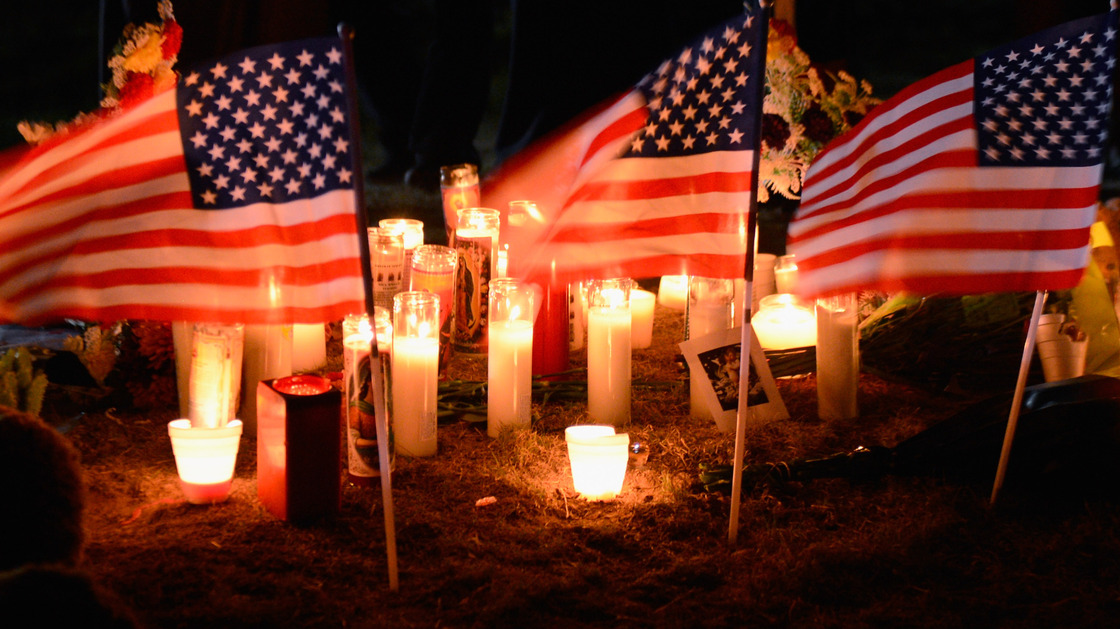 A memorial outside the movie theater in Aurora, Co., where 12 people died and about 58 were wounded by a gunman early Friday.