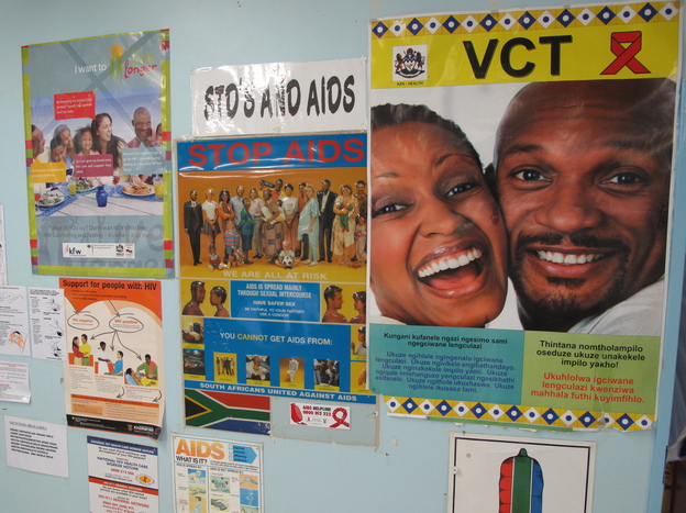 Anti-AIDS posters hang in the Eshowe public health clinic in South Africa's Kwazulu-Natal province. Clinicians there are hoping to slow the spread of HIV by getting more people treatment.