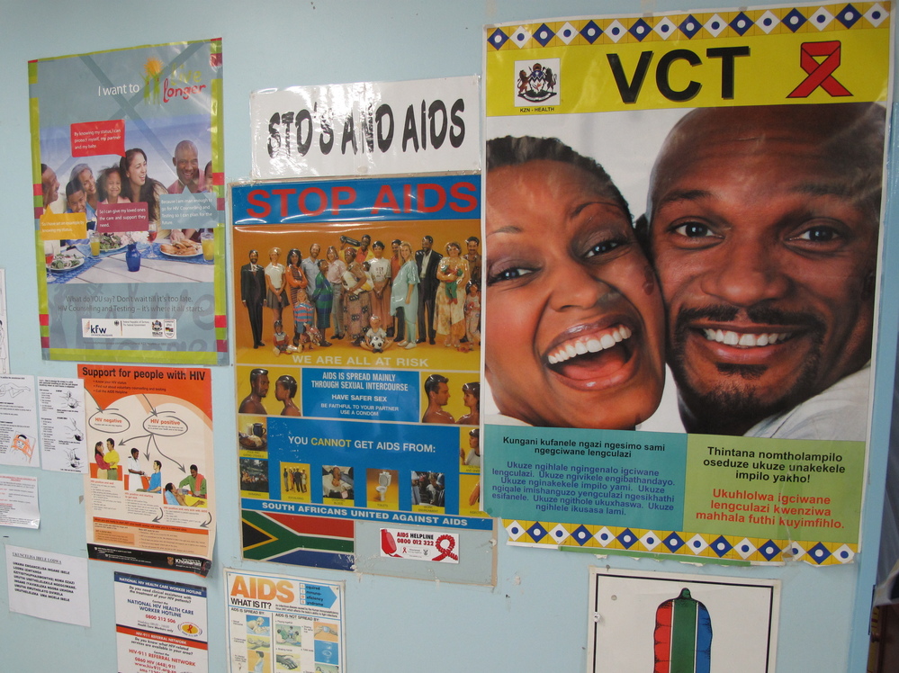 Anti-AIDS posters hang in the Eshowe public health clinic in South Africa's Kwazulu-Natal province. Clinicians there are hoping to slow the spread of HIV by getting more people treatment.