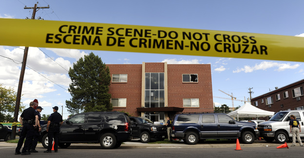 Police surround the apartment of James Holmes, the suspect in the Colorado theater shooting, on Friday in Aurora, Colo.