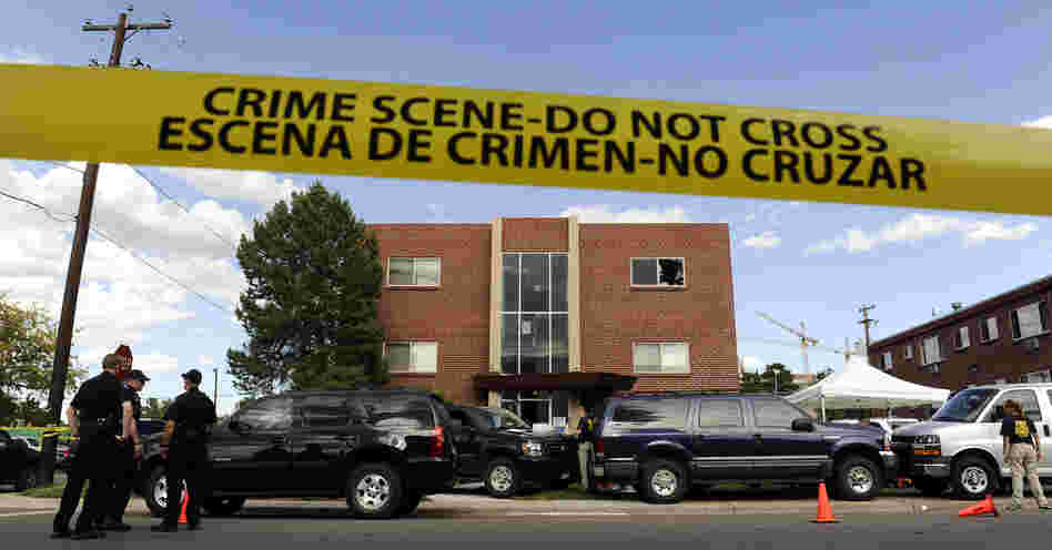 Police surround the apartment of James Holmes, the suspect in the Colorado theater shooting, on Friday in Aurora, Colo.