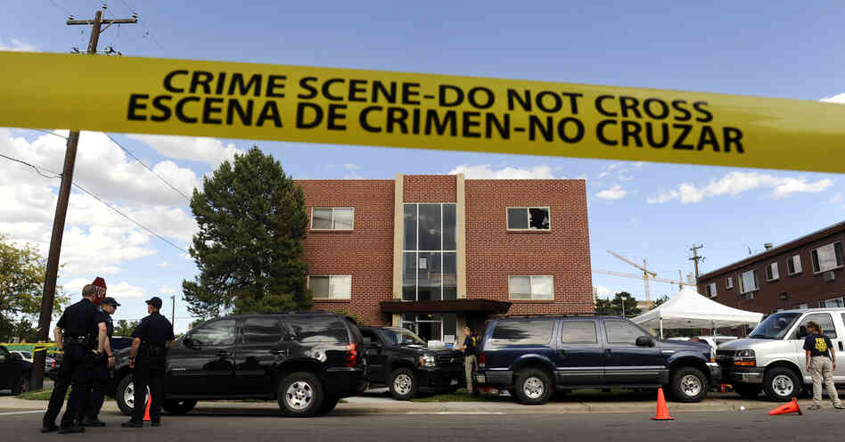 Police surround the apartment of James Holmes, the suspect in the Colorado theater shooting, on Friday in Aurora, Colo.