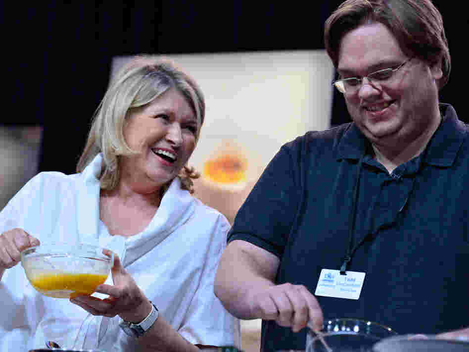 Martha Stewart and Todd VanDerWerff work on omelets during her cooking demonstration.