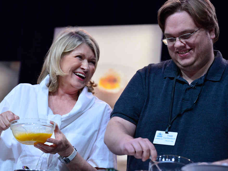 Martha Stewart and Todd VanDerWerff work on omelets during her cooking demonstration.