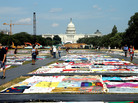 Visitors view the AIDS Memorial Quilt at the National Mall in Washington, D.C., where the International AIDS Conference is being held this week. Visitors view the AIDS Memorial Quilt at the National Mall in Washington, D.C., where the International AIDS Conference is being held this week.