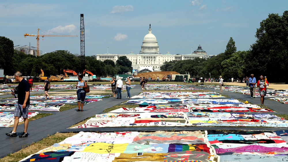 Visitors view the AIDS Memorial Quilt at the National Mall in Washington, D.C., where the International AIDS Conference is being held this week.