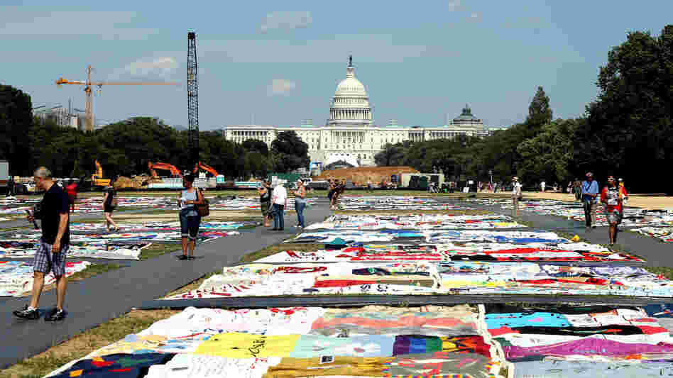 Visitors view the AIDS Memorial Quilt at the National Mall in Washington, D.C., where the International AIDS Conference is being held this week.