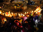 Mourners create a memorial at the fountain of the Aurora Municipal Center after a prayer vigil Sunday for the 12 victims of Friday's mass shooting at the Century 16 movie theater. Mourners create a memorial at the fountain of the Aurora Municipal Center after a prayer vigil Sunday for the 12 victims of Friday's mass shooting at the Century 16 movie theater.
