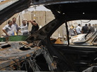 In Baghdad's Sadr City district, the view through a vehicle that was destroyed in one of today's attacks. In Baghdad's Sadr City district, the view through a vehicle that was destroyed in one of today's attacks.