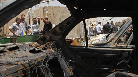 In Baghdad's Sadr City district, the view through a vehicle that was destroyed in one of today's attacks. In Baghdad's Sadr City district, the view through a vehicle that was destroyed in one of today's attacks.