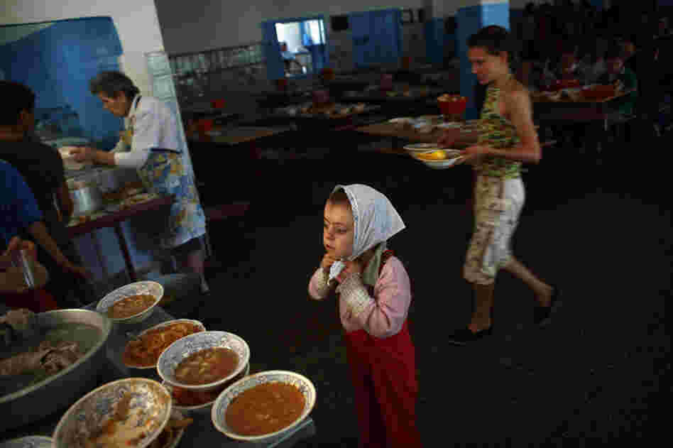 Children clean up after lunch at a boarding school and orphanage in Chisinau, Moldova, May 2009. The school has more than 500 children living on campus.
