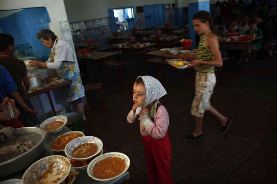 Children clean up after lunch at a boarding school and orphanage in Chisinau, Moldova, May 2009. The school has more than 500 children living on campus.