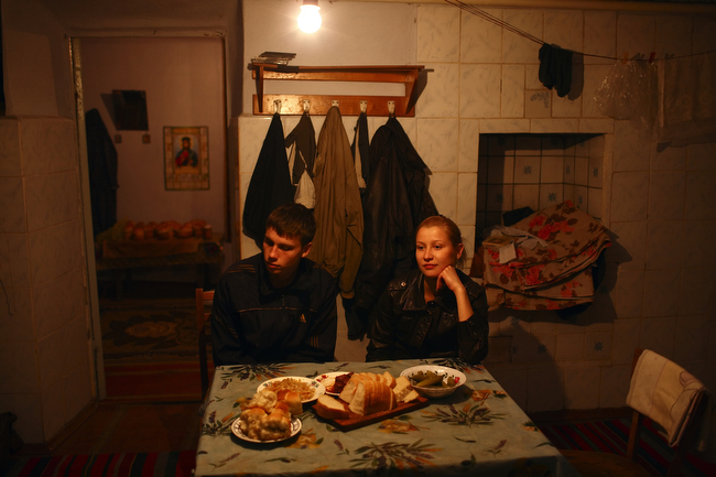 Dinner in a farmhouse in Chobruchi, Moldova, April 2009.
