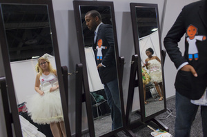 The organizers of the show aimed to reduce the taboo of talking about female condoms and the role they can play in stopping HIV infections. Kristina DeRose (left) from Philadelphia, Cramonte Hairston (center) and Iesha Gadsden of Washington, prepare backstage.