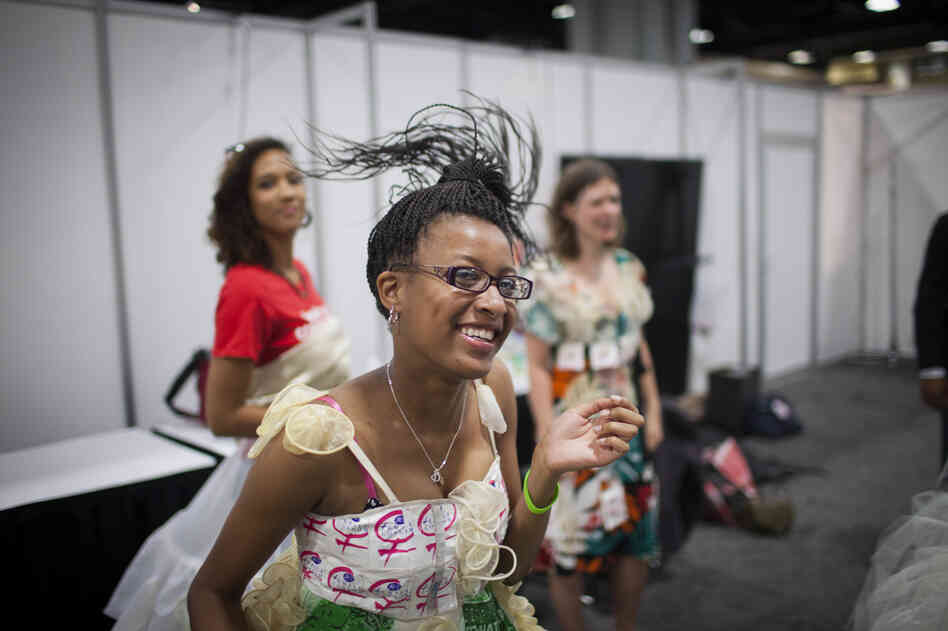 A fashion show at the 19th International AIDS Conference aimed to raise awareness of female condoms — the only woman-initiated means of contraception that can prevent HIV infection. Diamond Gillespie has a laugh before going on stage. The top of her dress is decorated with female condom wrappers.