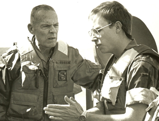 David Crist's father, George (left), discusses operations against Iranian attack boats with Navy Lt. Paul Hillenbrand. George Crist, a Marine Corps general, was commander of CENTCOM from 1985-1988.
