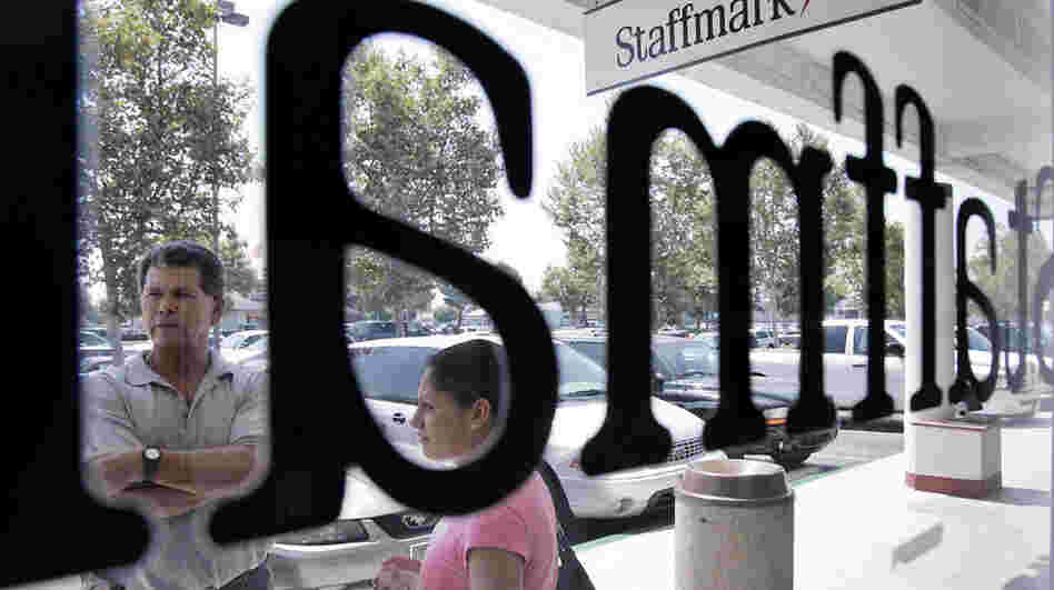 Job applicants outside the Staffmark temp agency in Cypress, Calif., in 2005. Temp hiring is usually a harbinger of an improving job market, but some analysts say more employers may be considering temps as a more permanent staffing solution.