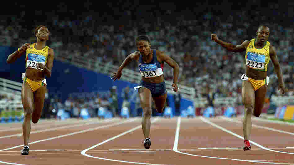 Sherone Simpson of Jamaica, Lauryn Williams of the U.S. and Veronica Campbell of Jamaica compete in the women's 100 meter final at the Athens 2004 Summer Olympic Games, the race in which Williams won her silver medal.