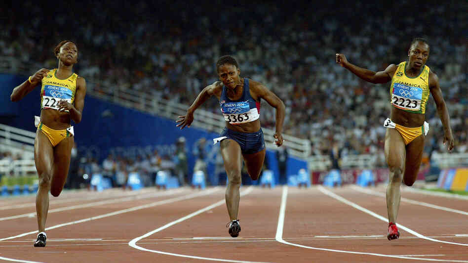 Sherone Simpson of Jamaica, Lauryn Williams of the U.S. and Veronica Campbell of Jamaica compete in the women's 100 meter final at the Athens 2004 Summer Olympic Games, the race in which Williams won her silver medal.