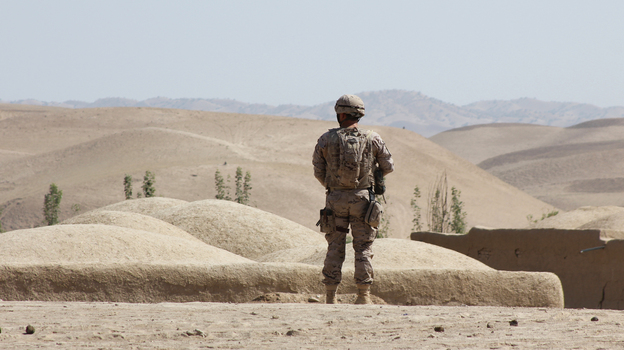 A Spanish NATO soldier on patrol in Afghanistan. Insurgents in the country have been busier this summer than last, and more often than not, civilians are paying the price.
